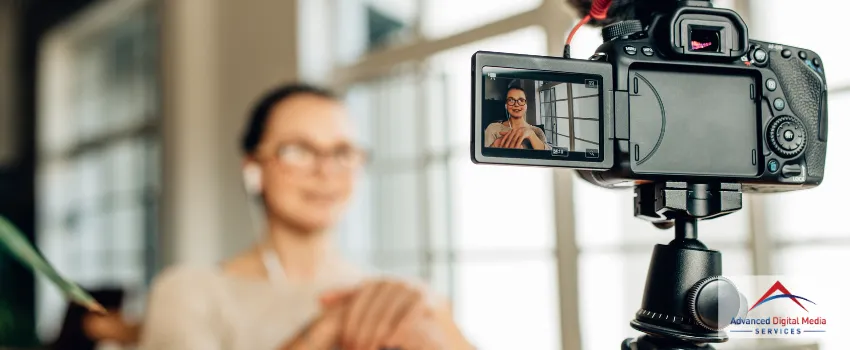 ADMS - A camera setup in front of a woman