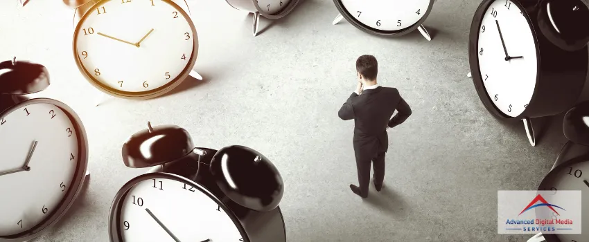 ADMS - Bird's eye shot of a business man thinking in the middle of many giant alarm clocks