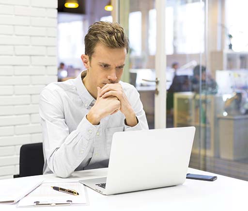 ADMS Businessman working at his laptop