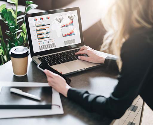 ADMS Young businesswoman is working on laptop